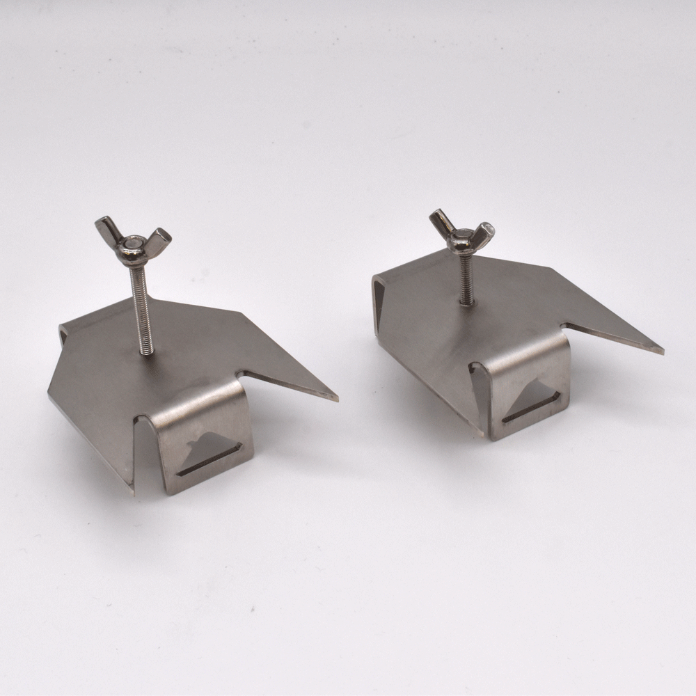 Two metallic skewer prongs on a white background