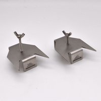 Two metallic skewer prongs on a white background