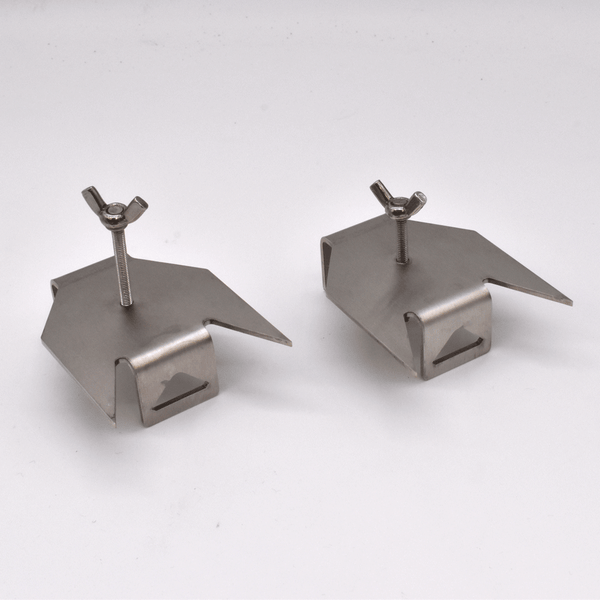 Two metallic skewer prongs on a white background