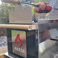 Rozza grill with a ham being cooked outdoors