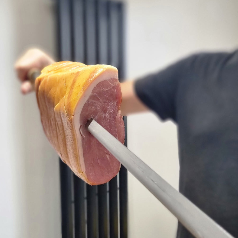 Rozza skewer pierced through a joint of ham