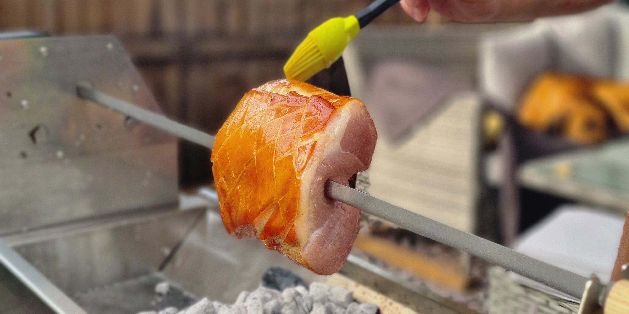 Ham being skewered and brushed over the Rozza